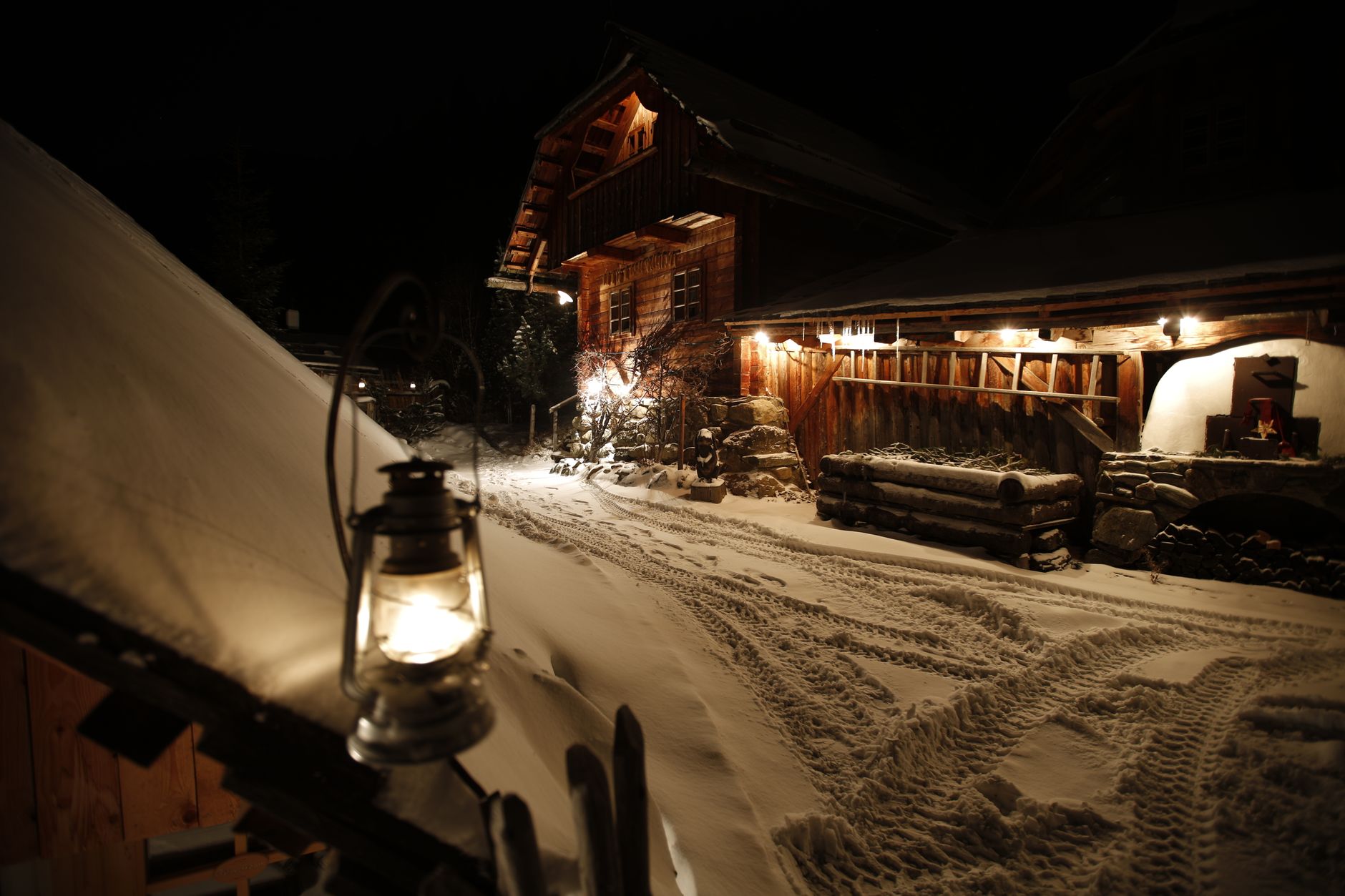 Warm wooden mountain cabin in snowy Italian Alps