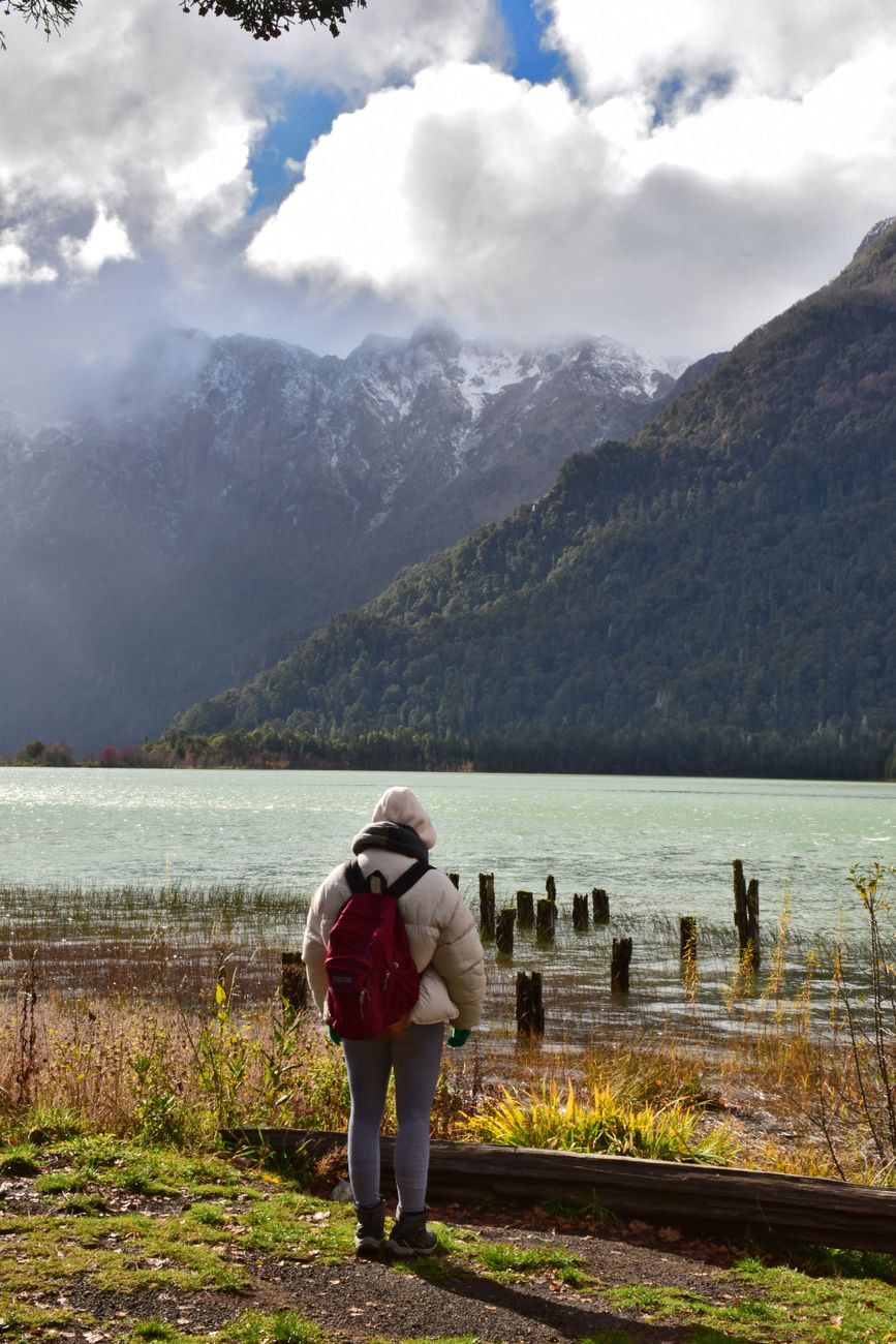 Minimalist traveler looking across Patagonian lake